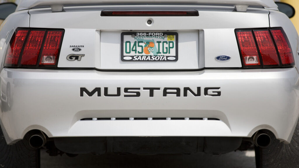 Is it against the law for a car to display two different license plates?