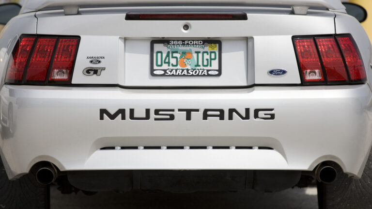 Is it against the law for a car to display two different license plates?